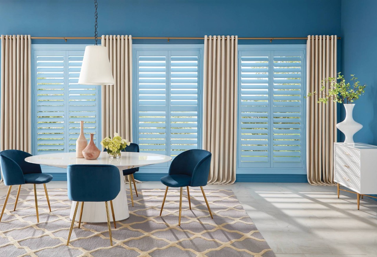 Light Blue Hunter Douglas Heritance® Wood Shutters decorating the windows of a contemporary home near Ocean City, MD
