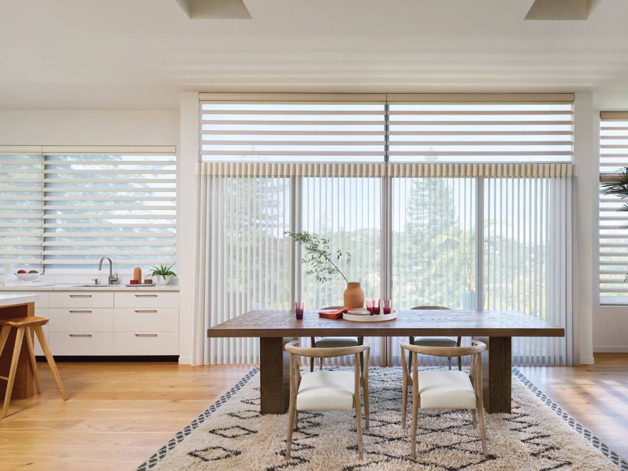 Hunter Douglas shades as soft window treatments on kitchen windows and a sliding glass door at Designing Windows near Ocean City, MD